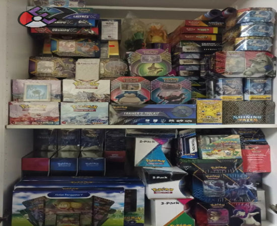 Shelves filled with various sealed Pokemon card product boxes, including booster boxes, collection tins, and other trading card game items.